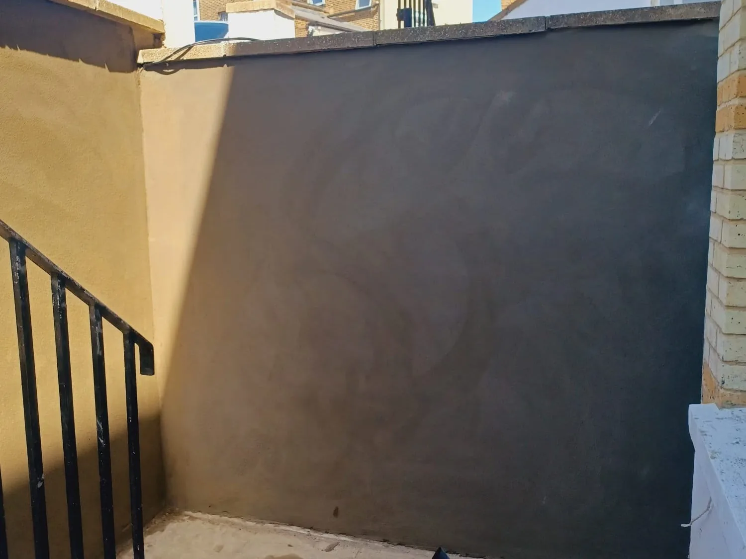 Completed external render finished to a clean, water-shedding surface