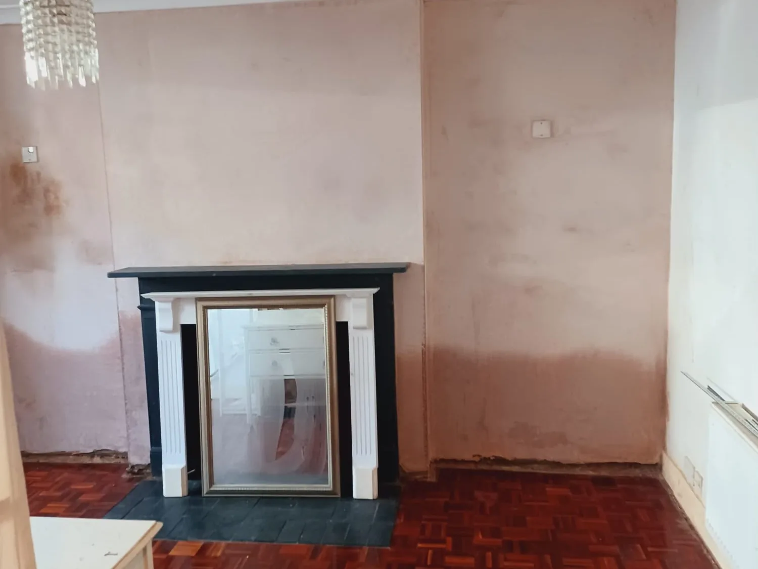 Rising damp on an internal wall before damp proofing treatment