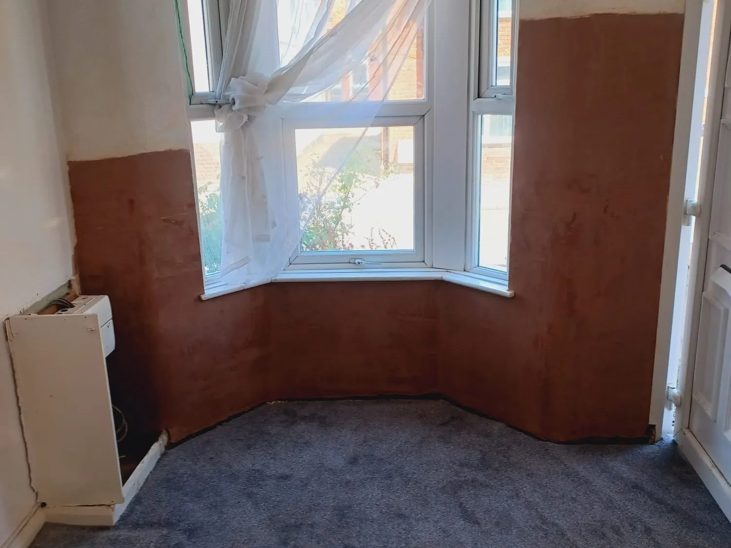 Wall replastered with salt-retardant plaster after rising damp treatment