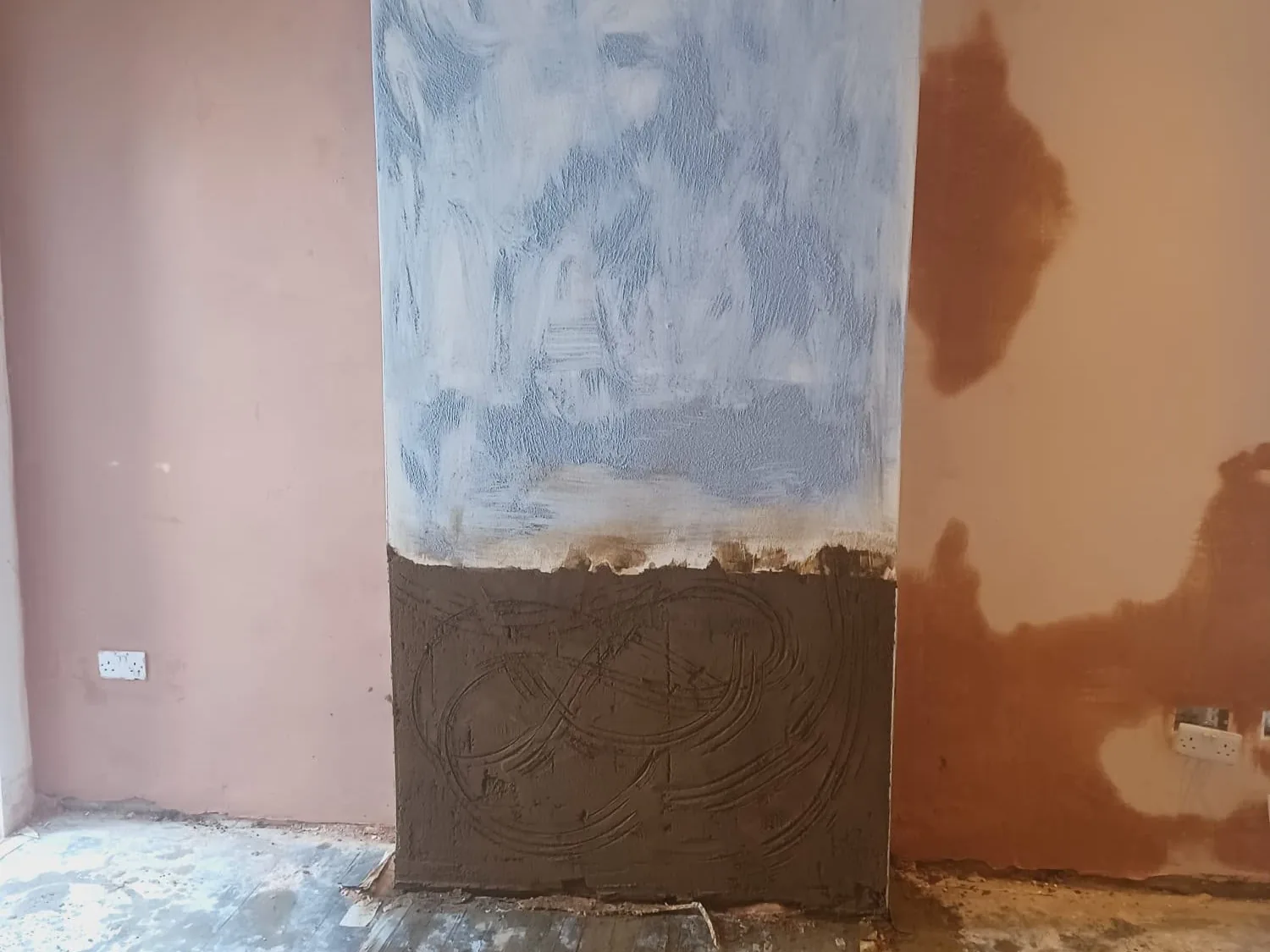Waterproof tanking coat applied over brickwork with damp proof render below