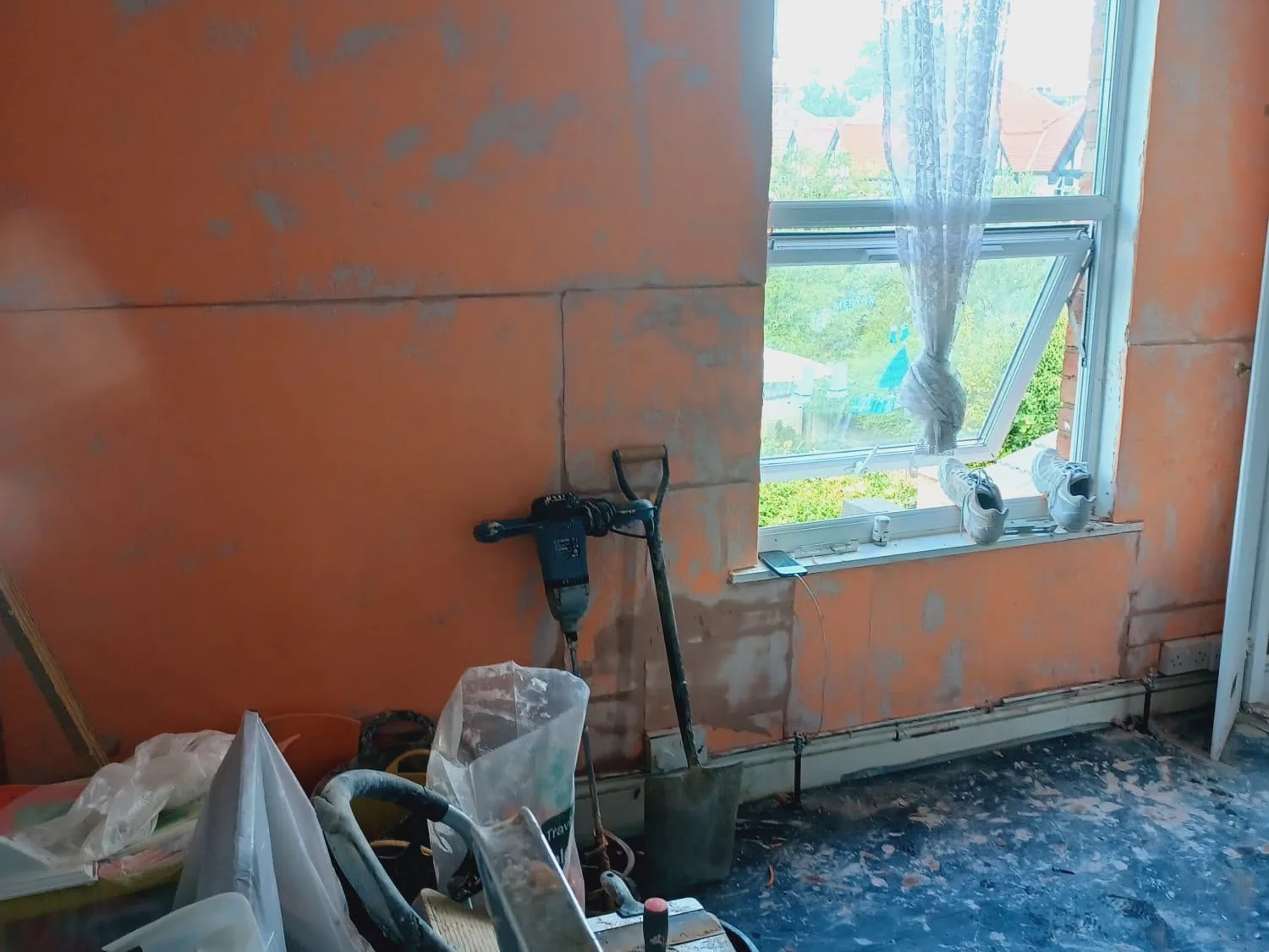 Wall stripped back to brickwork during rising damp treatment