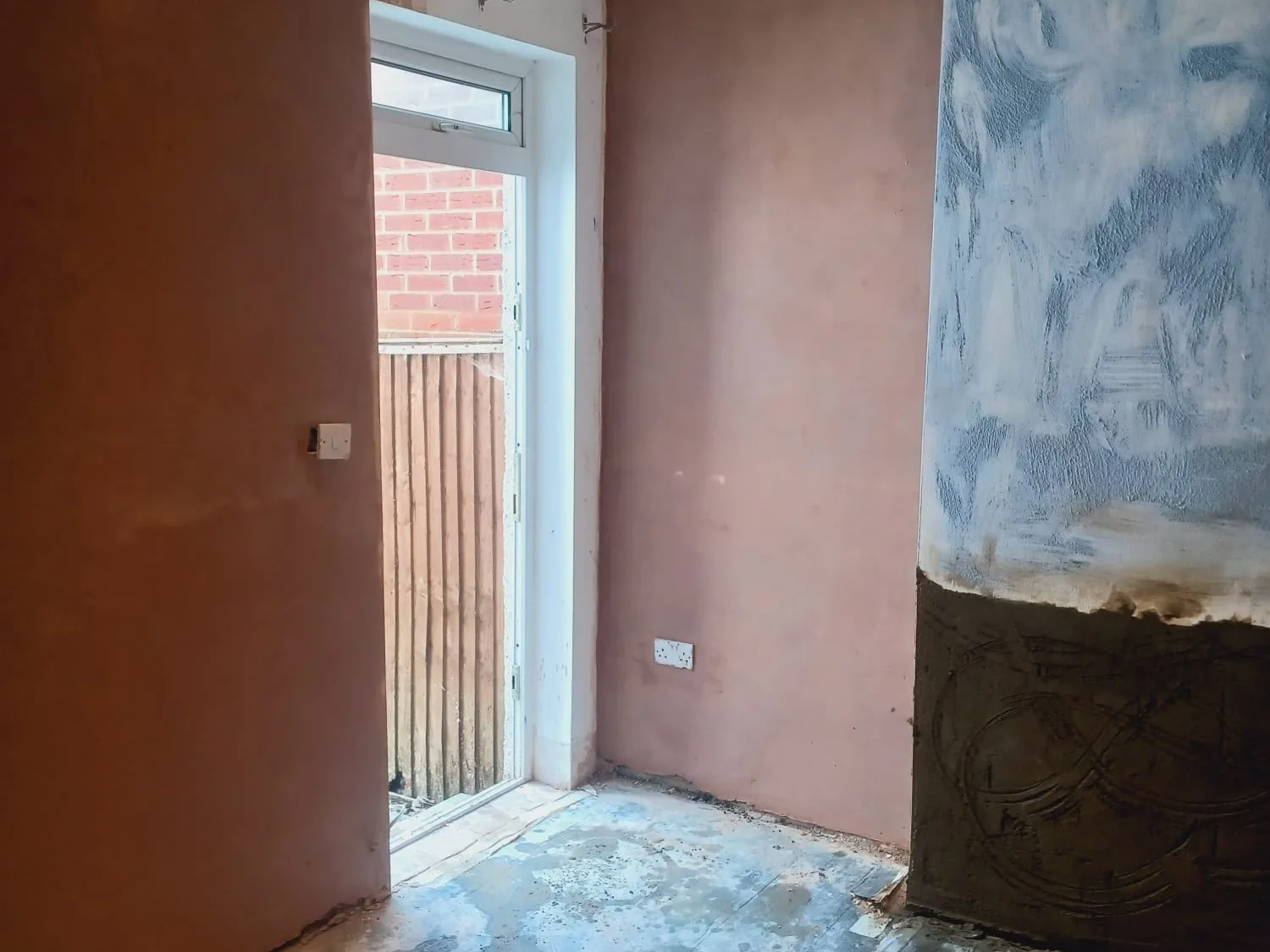 Waterproof tanking system applied to a basement wall