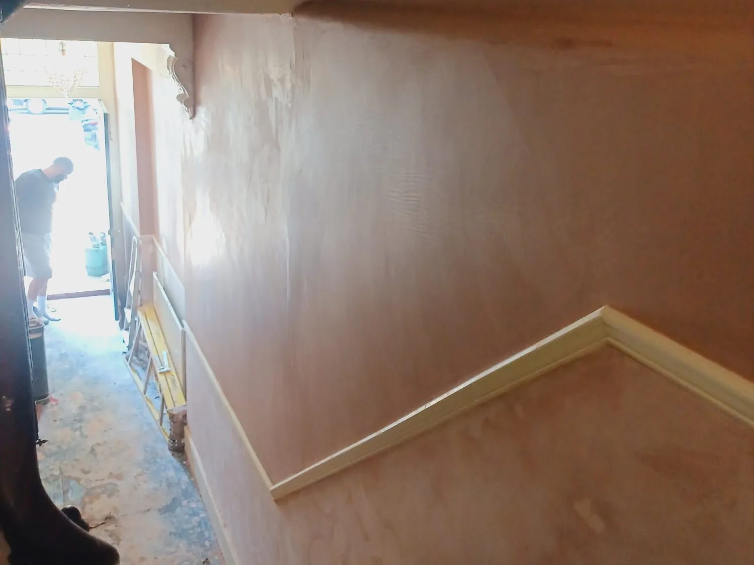 Room replastered to a flat, decoration-ready finish after damp treatment