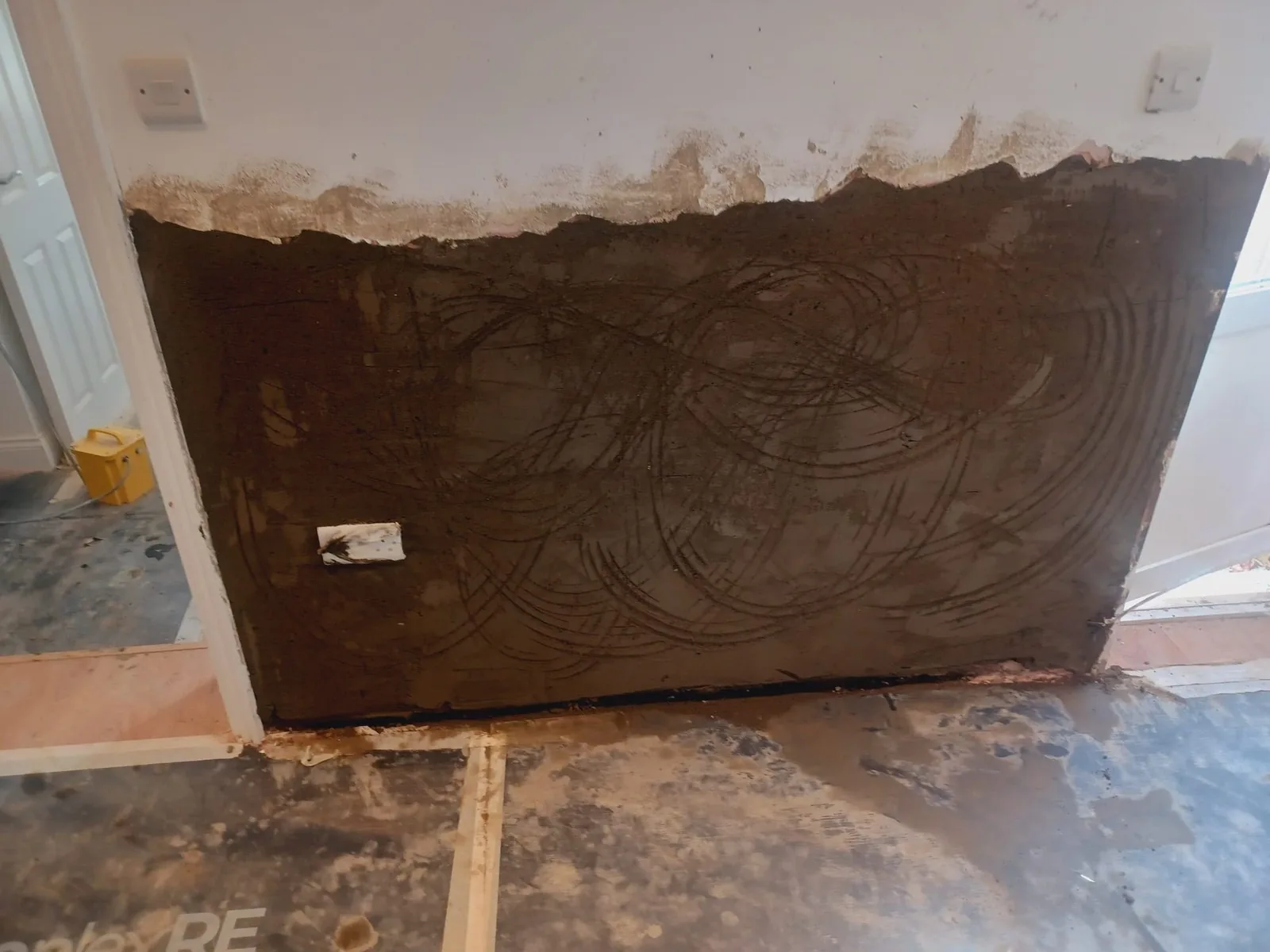 Rising damp treatment in progress to a ground-floor wall